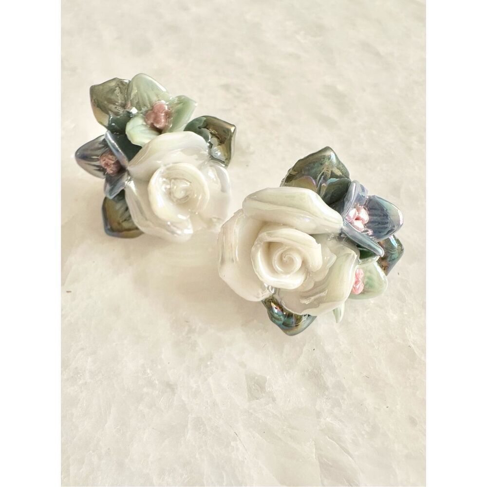 Pearlescent white rose and blue floral stud earrings
